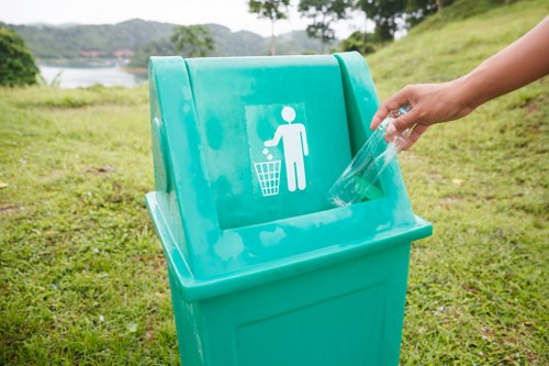 Modern rubbish collection vehicles in action